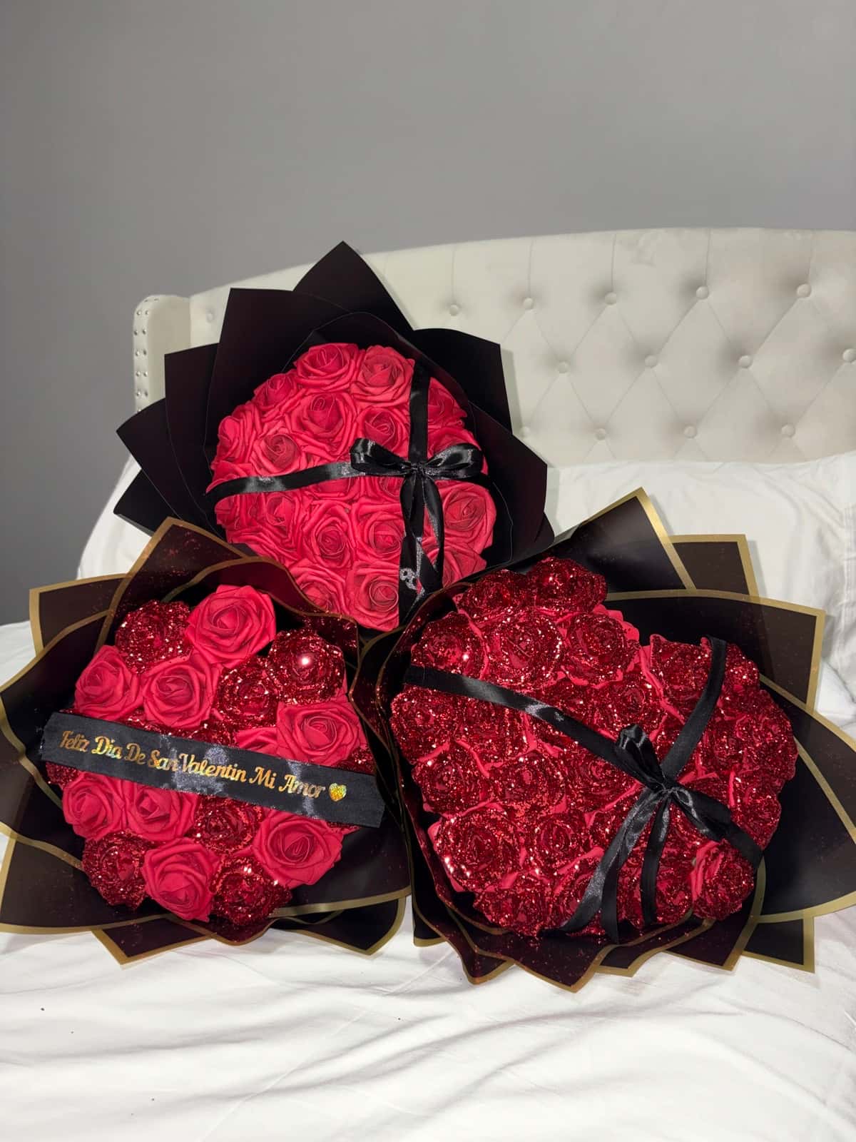 Red glitter heart-shaped rose bouquets in black and gold wrap